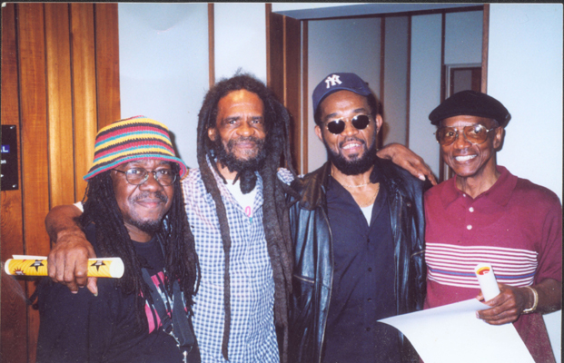 Four architects of Jamaican Ska Music: (left to right) Lester Ska Sterling- alto saxophone, Johnnie Moore- trumpeter, both with the famous 'Skatalites Band', Prince Buster- originator of Ska, and Carlos Malcolm- arranger and leader of Carlos Malcolm and His Afro-Jamaican Rhythms.