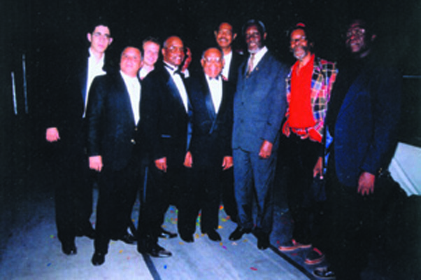 Carlos Malcolm (4th from left) and some members of his Orchestra, Carlos Malcolm and His Afro-Jamaican Rhythms with Hon. P.J. Patterson, Prime Minister of Jamaica (3rd from right)